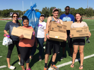 students with donation boxes