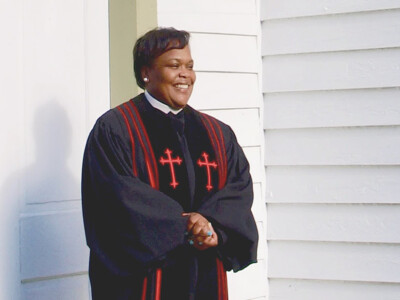 female pastor in robe